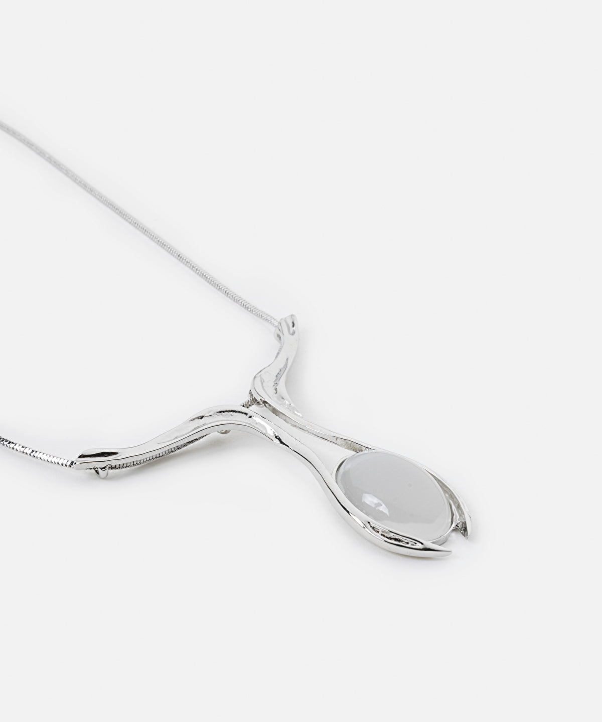 Necklace with contrasting resin pendant