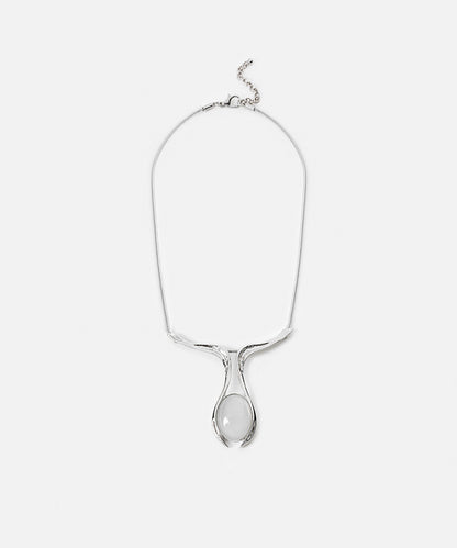 Necklace with contrasting resin pendant