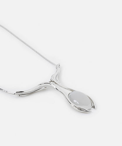 Necklace with contrasting resin pendant
