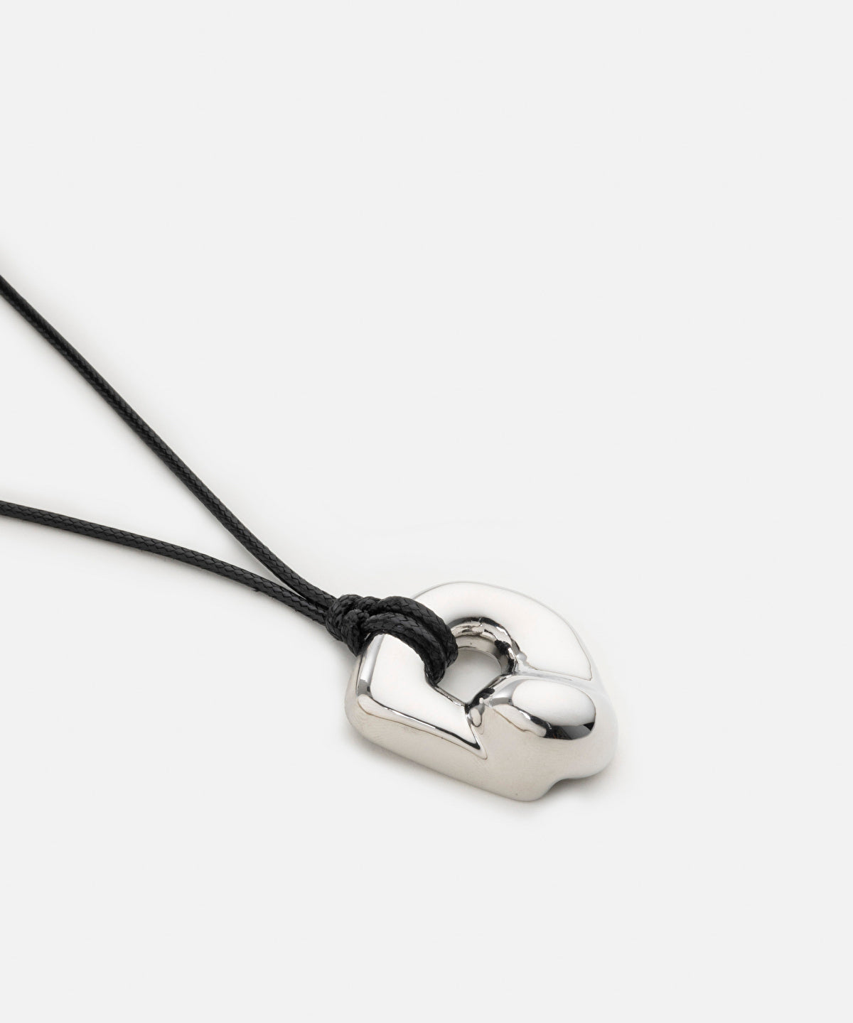 Cord necklace with metal pendant